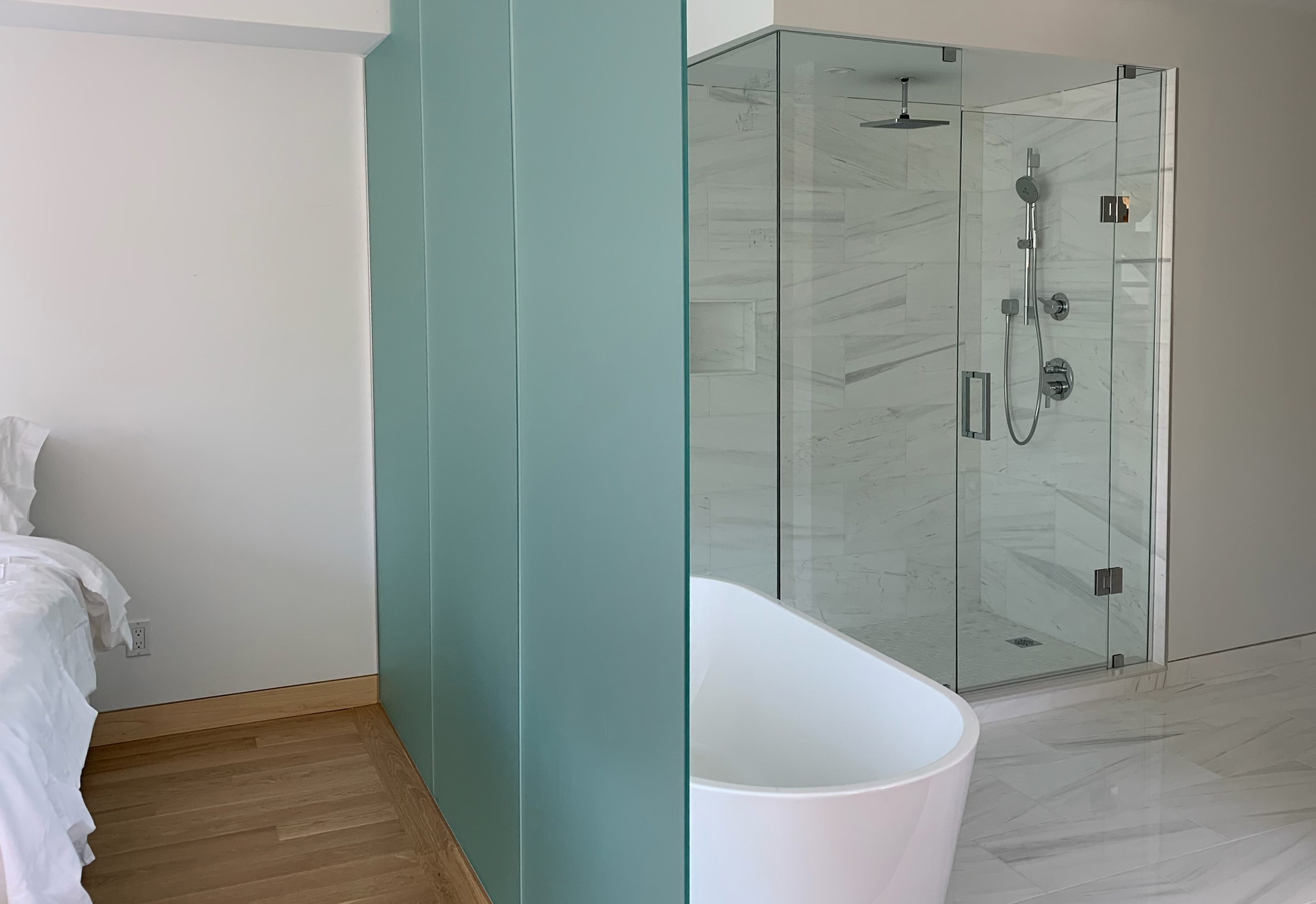 Glass partition and shower enclosure